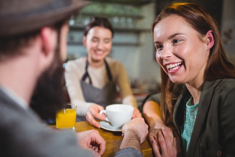waitress-serving-cup-coffee-customers